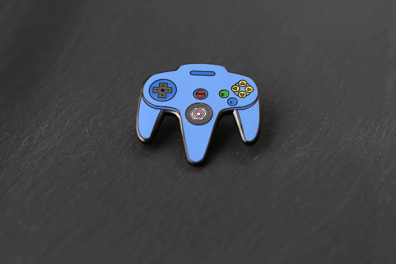 Real Sic: N64 Video Game Controller Enamel Pin - Blue