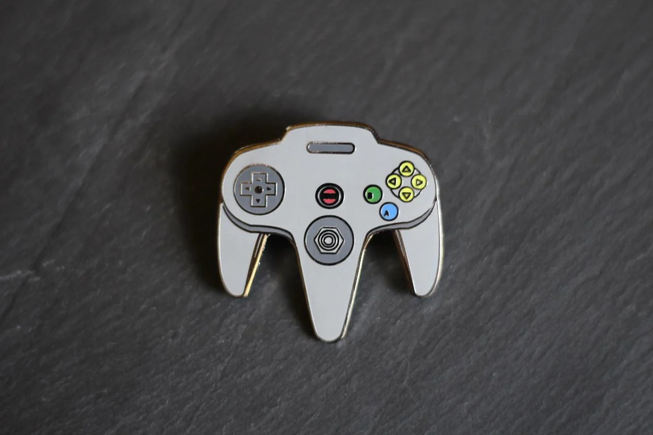 Real Sic: N64 Video Game Controller Enamel Pin - Grey