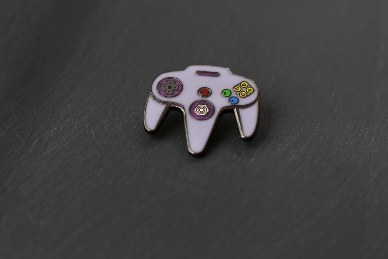 Real Sic: N64 Video Game Controller Enamel Pin - Purple