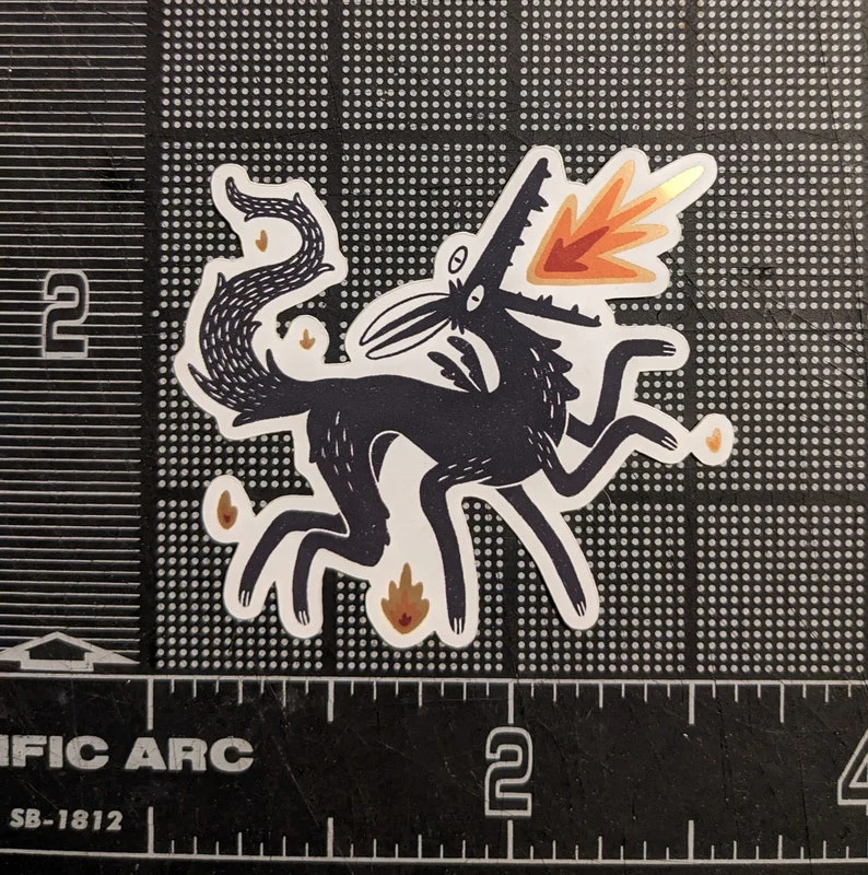 The Laughing Crow: Sticker - Spicy Noodle Red Metallic Dog - Image 2